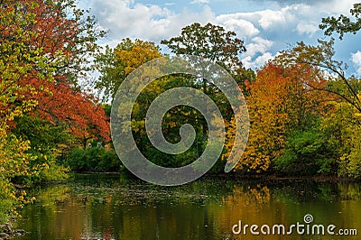 Colorful autumnal shoreline of the Red Cedar River in Michigan Stock Photo