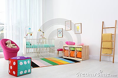 Colorful baby room interior with crib Stock Photo