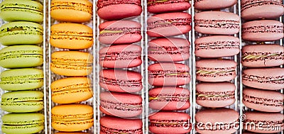 Colorful background of rows of french macaroons. Close up of macaroon cookies Stock Photo