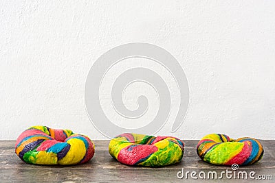 Colorful bagels on a wooden table Stock Photo