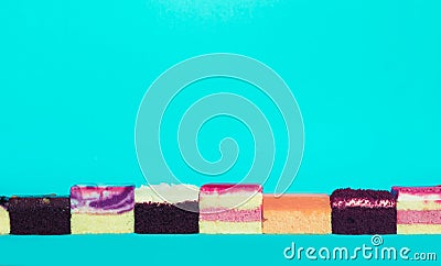 Colorful bakery slice on blue background.Food and healthy concepts Stock Photo