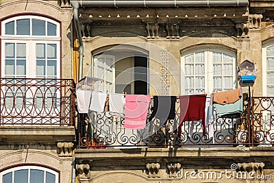 Colorful balcony with clothes hanging. Porto. Portugal Stock Photo