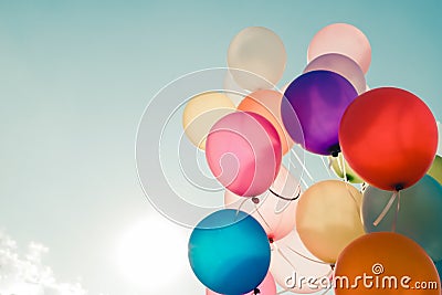 Colorful balloons flying on sky Stock Photo