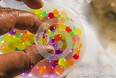 Colorful balls reflection in hydrogel ball Stock Photo