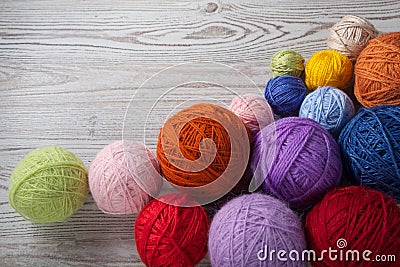 Colorful balls of yarn on a table Stock Photo