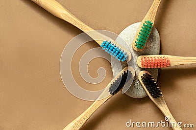 Colorful bamboo brushes on stone and natural paper background, flat lay Stock Photo