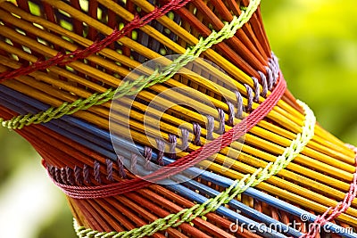 Colorful Bamboo wooden stool close up with blurred green Background Stock Photo