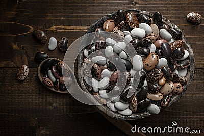 Colorful Beans on Dark Wooden Background Stock Photo