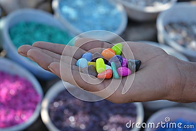 Colorful stones in hand Stock Photo