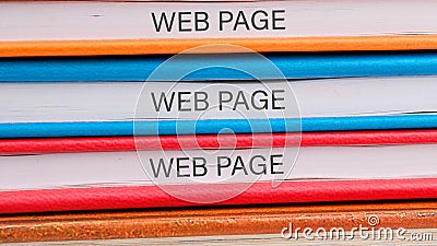 Colorful binders stacked neatly, each labeled with the words web page, representing the organization of materials Stock Photo