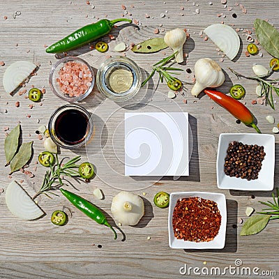Colorful blank stickers for notes and pepper, bay leaf, rosemary, onions, salt, olive oil Stock Photo