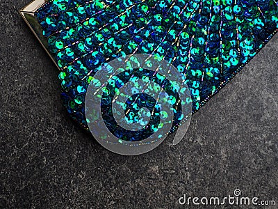 Colorful blue and green mixed round iridescent sequins, beads on knitting fabric for holiday, festive beautiful colorful Stock Photo