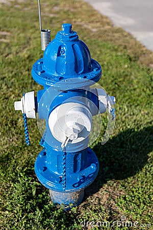 Colorful Blue and white Fire Hydrant used for supplying water Stock Photo