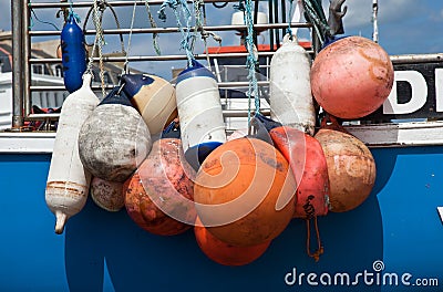 Colorful boat bumpers Stock Photo