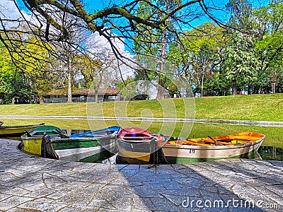 Colorful boats anchored on a peaceful lake Stock Photo