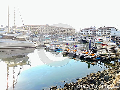 Colorful boats on the marina on a bright sunny day. Editorial Stock Photo