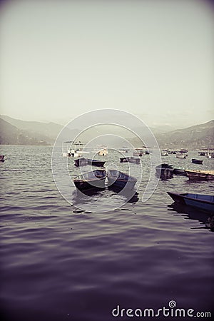 Colorful boats in Phewa Lake in Pokhara Stock Photo