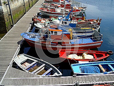 Colorful boats in spanish harbour Stock Photo