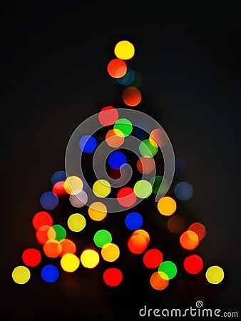 colorful bokeh of Christmas tree black background Stock Photo