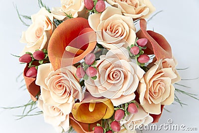 Colorful bouquet of orange calla lilies on a white Stock Photo