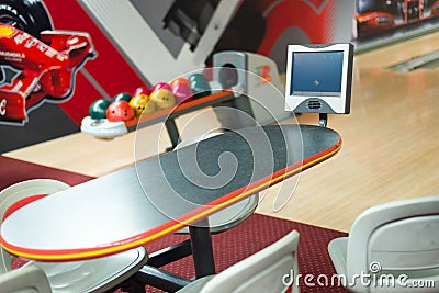 Colorful bowling balls at table Stock Photo