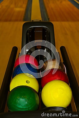 Colorful bowling balls waiting for use Stock Photo