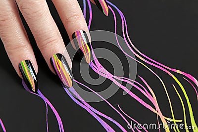 Colorful bright manicure with different sharp shape of nails framed with black lacquer.Nail art. Stock Photo