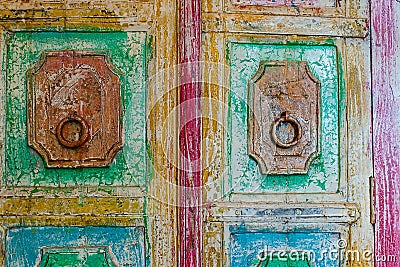 A colorful bright old door with round handles Stock Photo