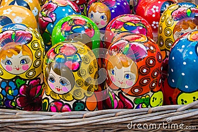 Colorful bright russian nesting dolls Matrioshka in the basket at the street market at Old Arbat street, iconic popular souvenir f Editorial Stock Photo