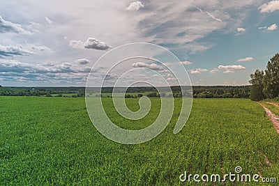 Colorful Bright Sunny Green Field, country-road, River Summer Landscape With Blue Cloudy Sky, Trees And Hills Stock Photo