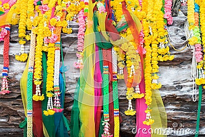 Colorful Buddhism garland on tree front view. Stock Photo