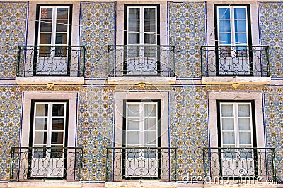 Colorful buildings, houses blue and green in Lisbon, Portugal. Old windows and Balconies popular and famous view. Stock Photo