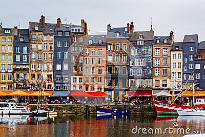 Colorful bulding and waterfront of Honfleur harbor in Normandy, France. Editorial Stock Photo