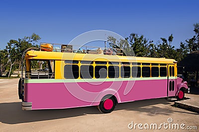 Colorful bus yellow and pink touristic tropical Stock Photo