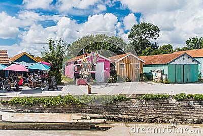 Colorful cabins on the port of the ChÃ¢teau d`OlÃ©ron Editorial Stock Photo