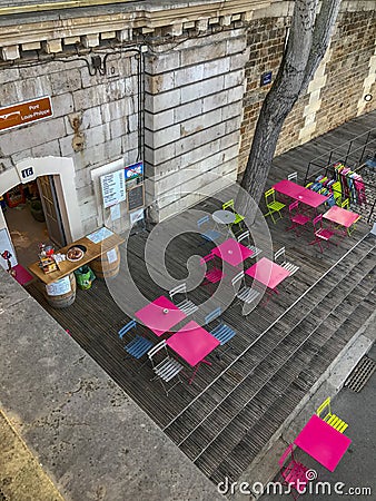 Colorful cafe tables on the Parc Rives de Seine, Paris Editorial Stock Photo