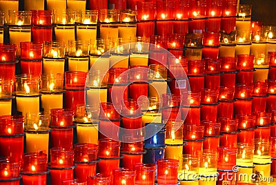 Colorful candles in glass red in the main Stock Photo