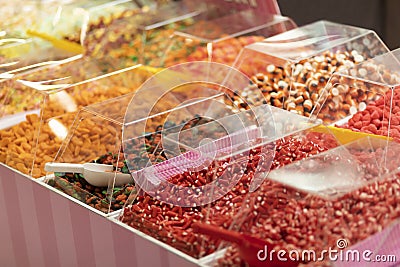 colorful candy, jelly sweets in plastic container on showcase in sweet-shop Stock Photo