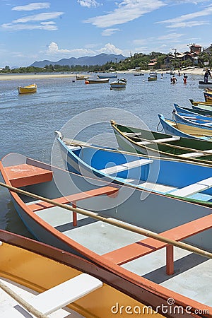 Colorful canoe boats parked on the body of the lake Editorial Stock Photo