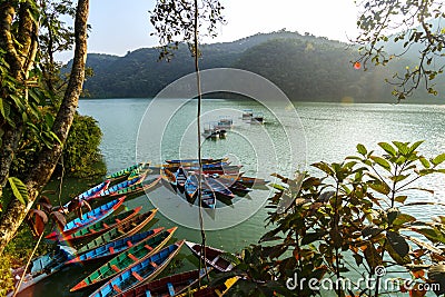 Boats on Phewa Lake in Pokhara, Nepal Stock Photo