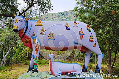 Colorful carved idols of many gods and goddesses on cow`s back, on the way to Kanchipuram, Tamil Nadu, India Stock Photo