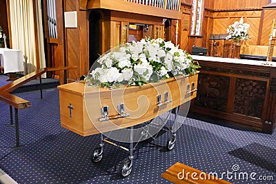 A colorful casket in a hearse or chapel before funeral or burial at cemetery Stock Photo