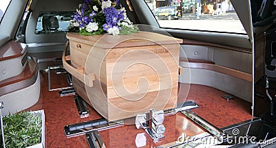 Colorful casket in a hearse or chapel before funeral or burial at cemetery Stock Photo