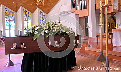 A colorful casket in a hearse or chapel before funeral or burial at cemetery Editorial Stock Photo