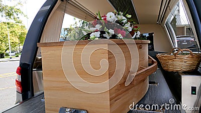 Colorful casket in a hearse or chapel before funeral or burial at cemetery Editorial Stock Photo