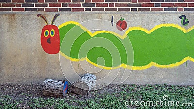 Colorful caterpillar painting outside Mount Auburn School in Dallas, Texas. Stock Photo