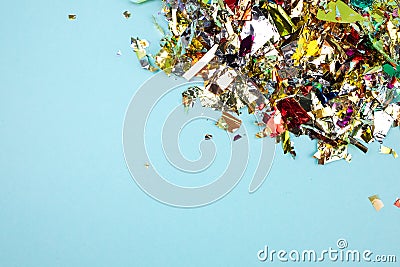 Colorful celebration background with confetti,stars, fireworks and decoration on blue background. Flat lay. Stock Photo