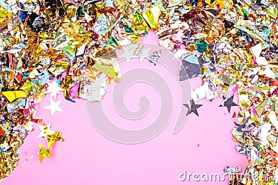 Colorful celebration background with confetti,stars, fireworks and decoration on pink background. Flat lay. Stock Photo