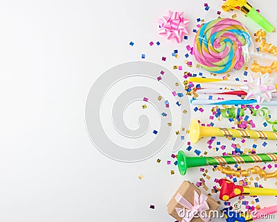 Colorful celebration background with various party confetti, streamers and decoration. Minimal party concept. Flat lay Stock Photo