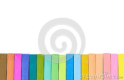 Colorful chalk pastel brown, orange, purple, green, blue, pink and yellow on white background. Stock Photo